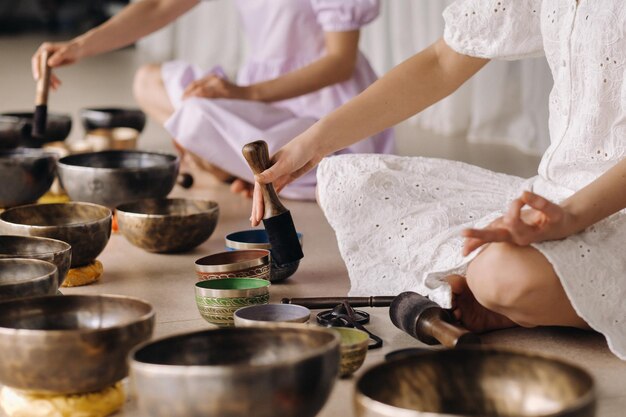 closeup of a tibetan singing bowl in your hands translation of mantras transform your impure body speech and mind into a pure exalted body speech and mind of a buddha