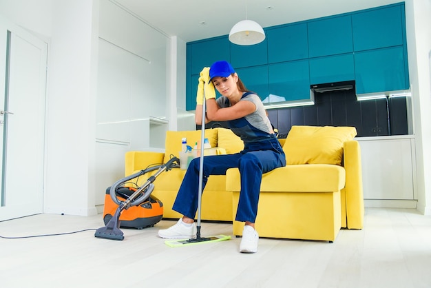 Photo closeup of a tired woman after house work