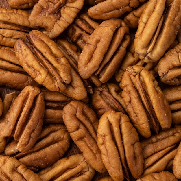 Фото Крупным планом вид сверху орехов пекан. фоне еды.