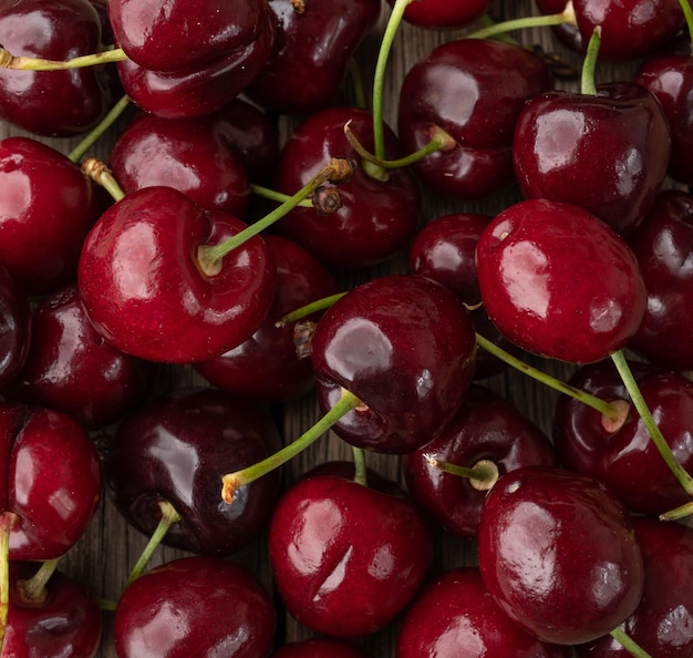 Closeup, top view of red cherries. Food backdrop.