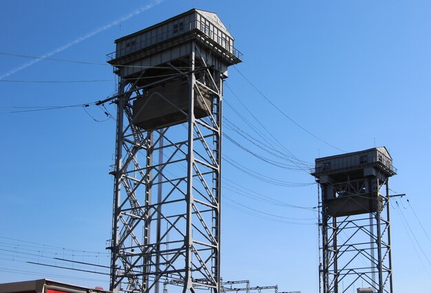 closeup towers with counterweights to raise the middle part twolevel bridge automobile and railway