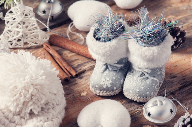 Closeup of toy boots and christmas decor 