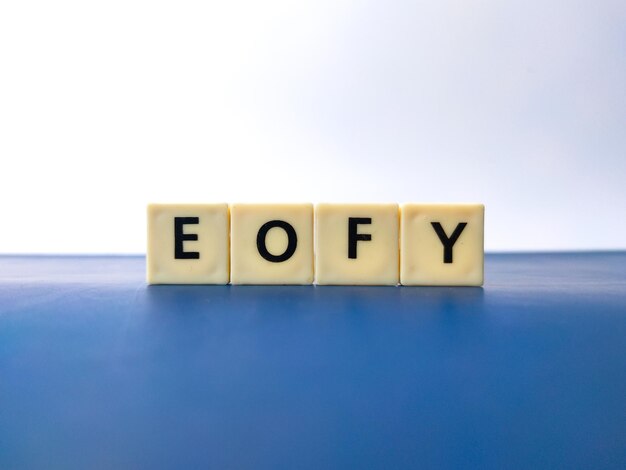 Closeup toys letters with the word EOFY