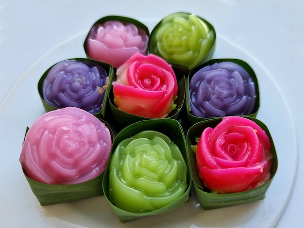 Closeup traditional colorful sweet Thai desserts Khanom Alua Kularb or Rose shaped sweetmeats