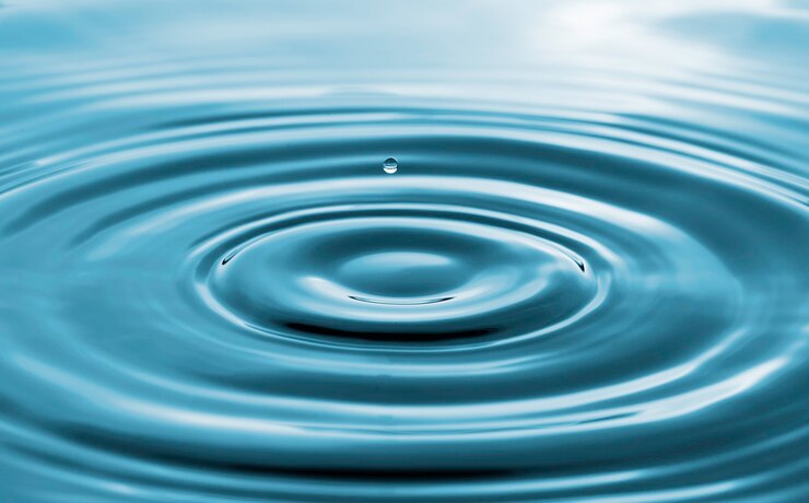 Closeup of transparent water droplet on water ring surface , Natural concept.