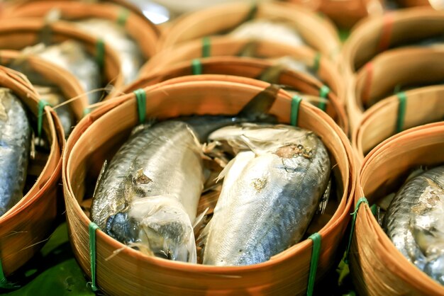 Closeup tuna fish steamed put in bamboo basket.