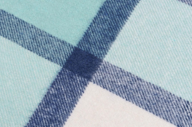 closeup turquoise and blue warm tartan fabric tilted Image for your design