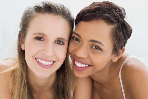 Closeup of two happy young female friends