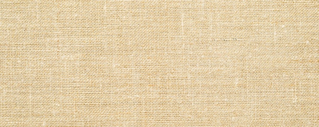 Closeup of undyed cotton canvas fabric texture background