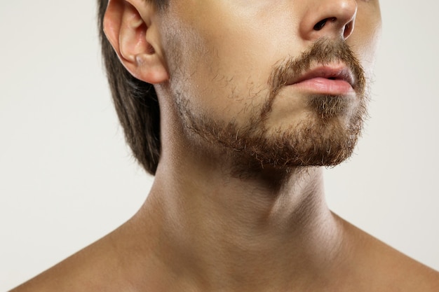 Closeup of unshaved men's face with a unkempt beard