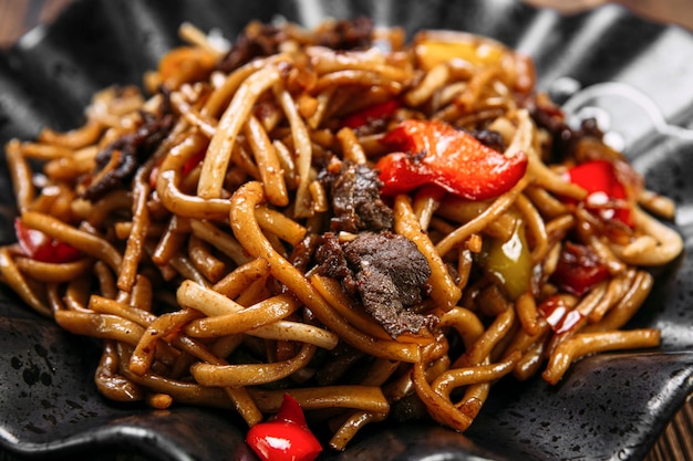 Closeup uyghur cuisine dish tsomyan fried noodles