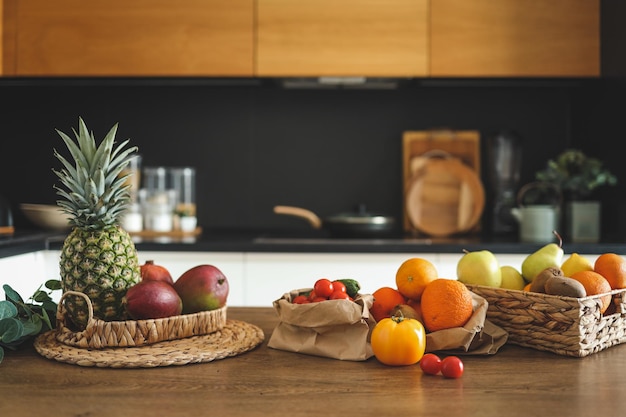 Closeup of vegetables and fruits on a wooden table in the background of the kitchen Balanced diet cooking nutrition concept