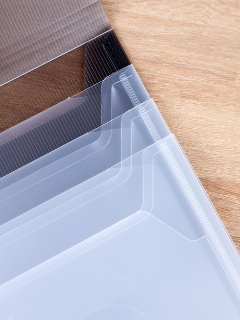 Closeup view of black plastic document folder on office table