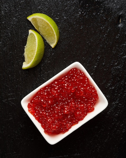 Closeup view of bowl with red caviar