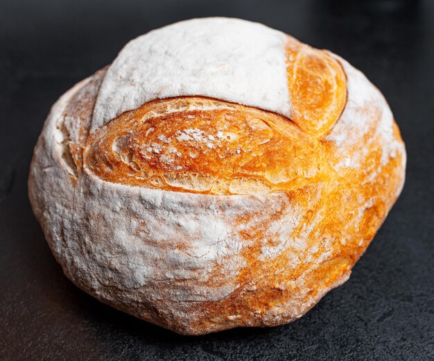 Closeup view of bread on black background