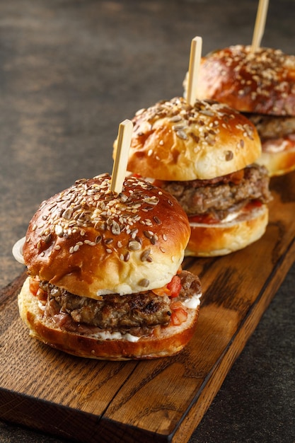 Closeup view of burger on wooden plate