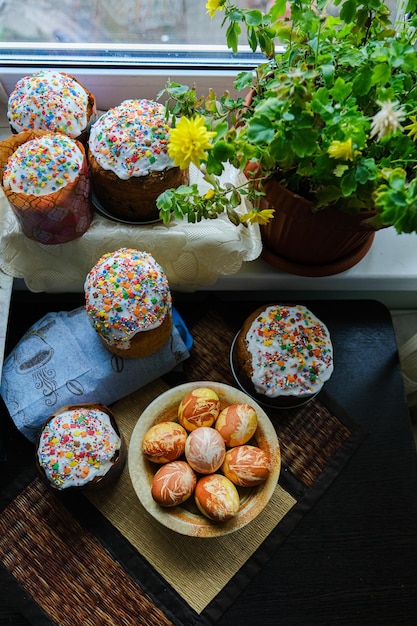 Closeup view of chicken eggs homemade easter cake and willow twigs