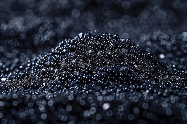 A closeup view of a cluster of black caviar with its shiny black pearls and delicate membranes