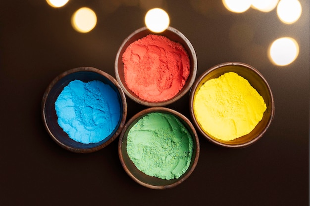 Closeup view of colorful Holi powder on the bowl