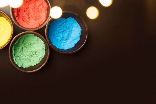 Closeup view of colorful Holi powder on the bowl