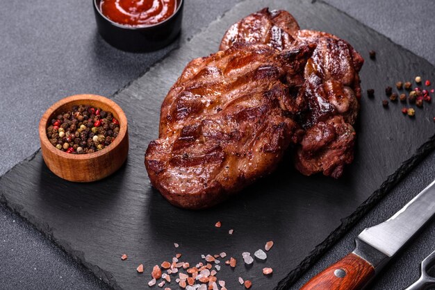 Closeup view of delicious grilled beef medallions served on table