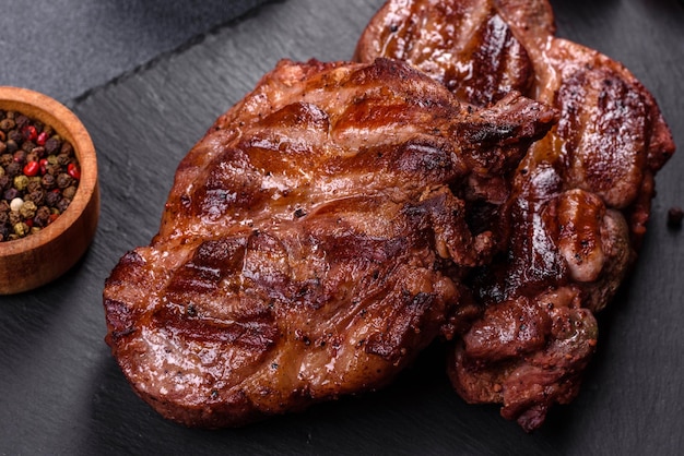 Closeup view of delicious grilled beef medallions served on table