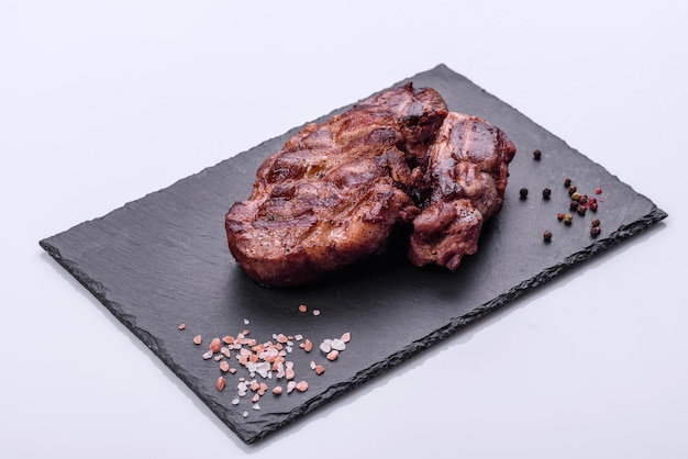 Closeup view of delicious grilled beef medallions served on table