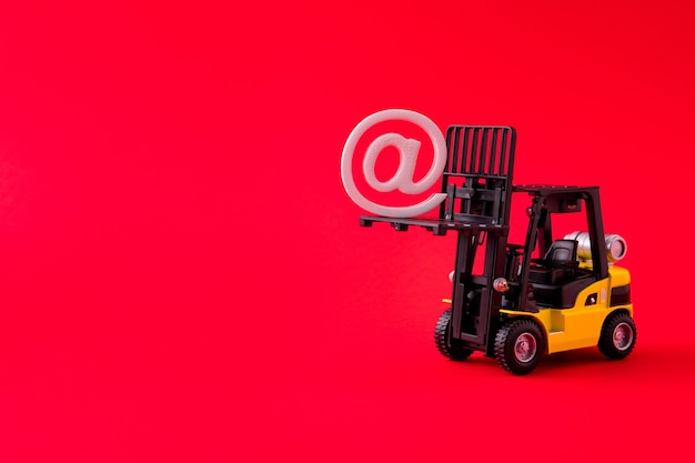 Closeup view of electric forklift carrying lifting up mail