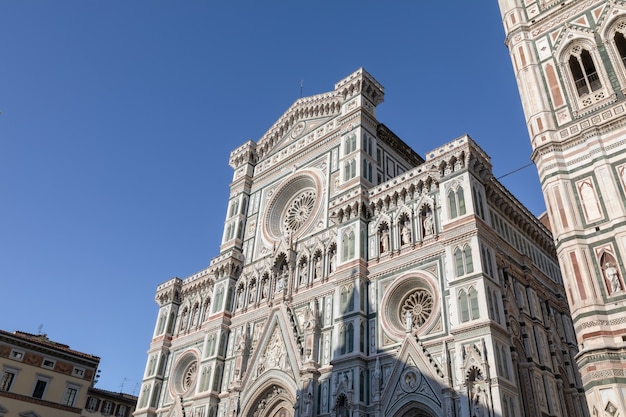 Closeup view of facade of Cattedrale di Santa Maria del Fiore (Cathedral of Saint Mary of the Flower) is the cathedral of Florence