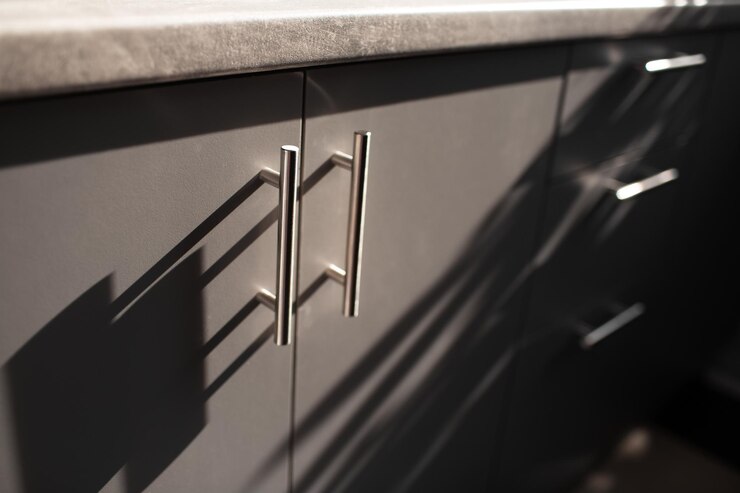 Closeup view of grey chipboard kitchen furniture