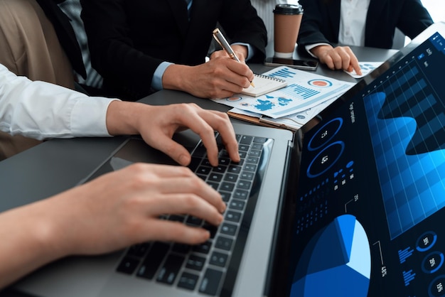 Closeup to view hand using laptop to analyze financial data in harmony office