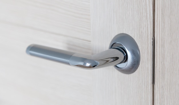 Closeup view of a metal door handle
