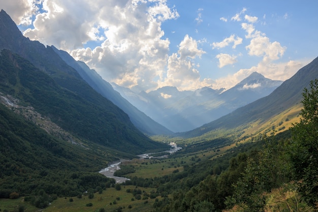 Closeup view mountains scenes in national park Dombai, Caucasus, Russia, Europe. Summer landscape, sunshine weather, dramatic blue sky and sunny day