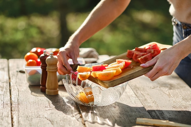 Closeup view of preparing vegetable salad for outdoor at picnic