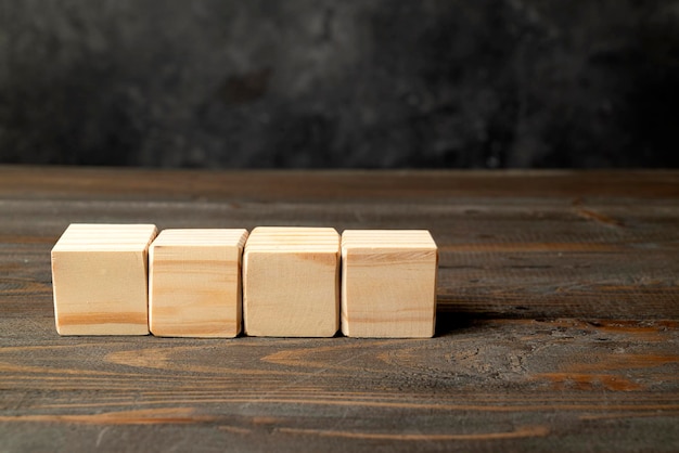 Closeup view row of wooden cubes