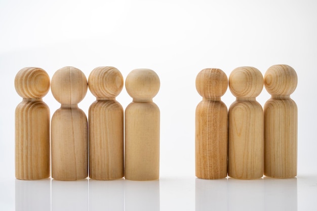 Photo closeup view row of wooden figure