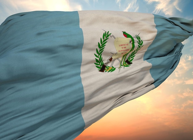 Closeup view of the waving flag of the Guatemala on a background of sunset