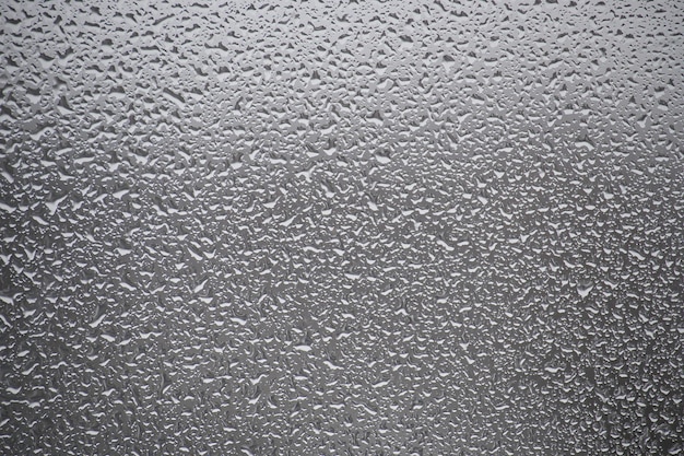 Closeup view of a window covered with raindrops