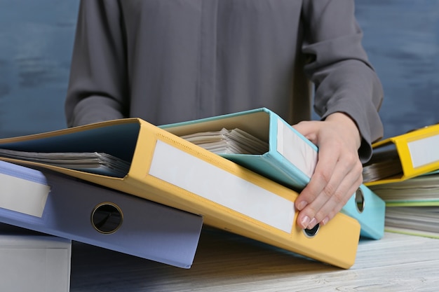 Closeup view of woman with document folders