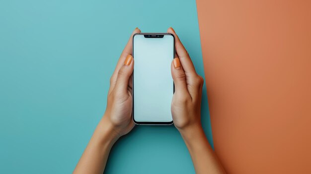 CloseUp View of a Womans Hands Holding a Smartphone Against a DualColor Background