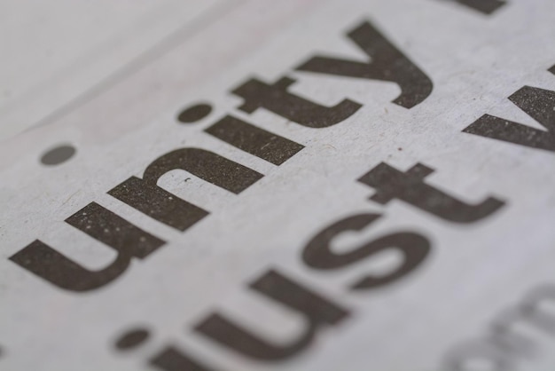 A closeup view of the wording Unity prominently displayed on a newspaper