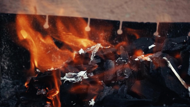 Closeup of a warm cozy burning fire in a metal brazier Slow motion HD video format