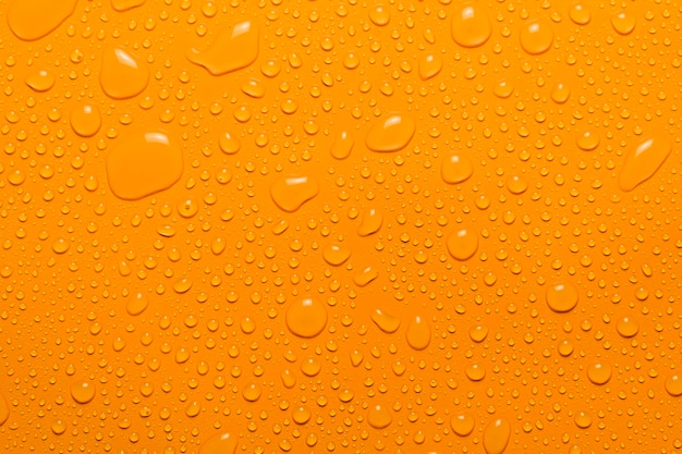 closeup water drop orange background