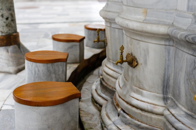 Closeup of water taps for ablution before visiting a mosque in Islamic culture Mosque in Istanbul