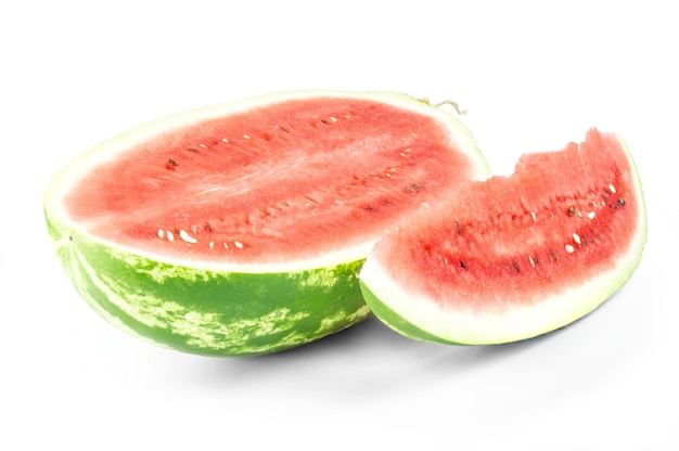 Closeup of watermelon half and slice on white