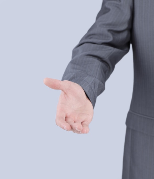 Closeup welcome to handshake businessman isolated on a light