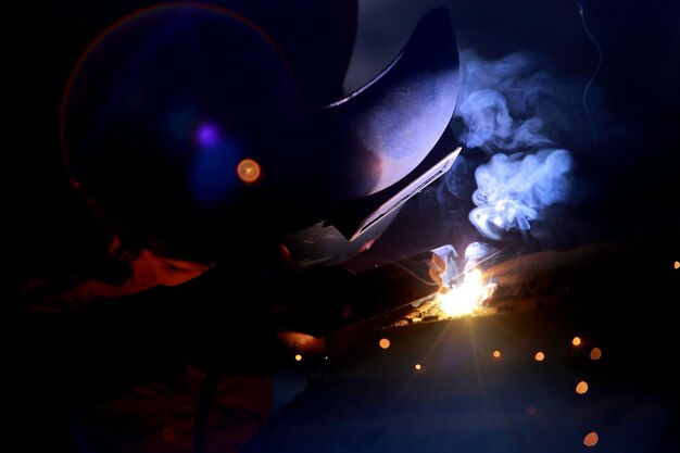 closeup of welder working in workshop