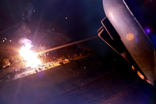 closeup of welder working in workshop