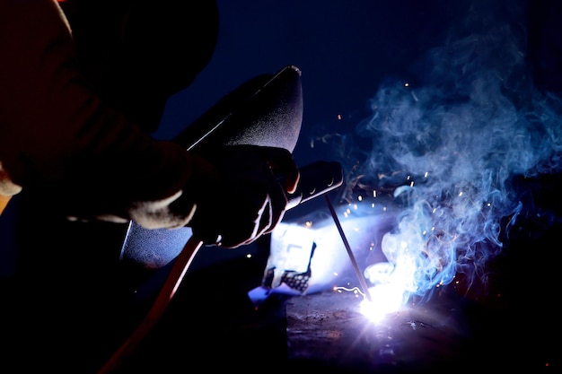 Closeup of welder working in workshop