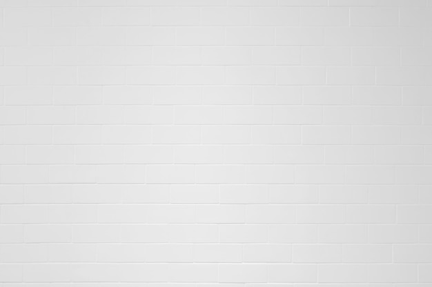 Closeup white brick wall tiles texture background